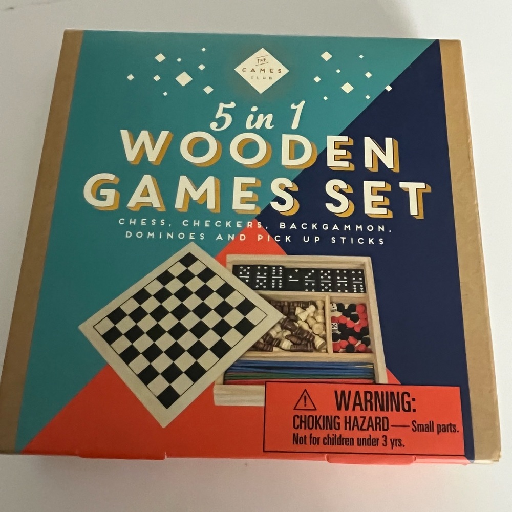 Nwot 5 in 1 wooden game set.  Includes chess, checkers, backgammon, dominoes